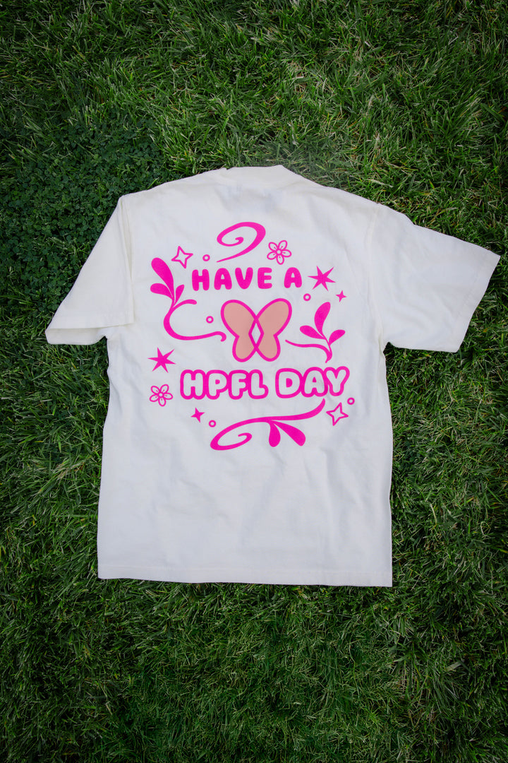 Hope showcasing back of HPFL day tee